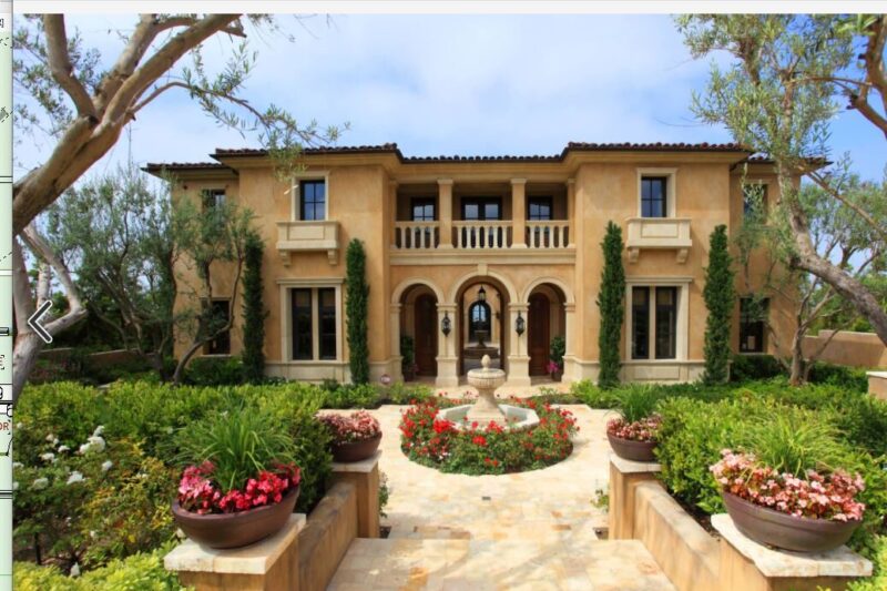 mediterranean inspired villa with flowered, landscaped garden and feature water fountain