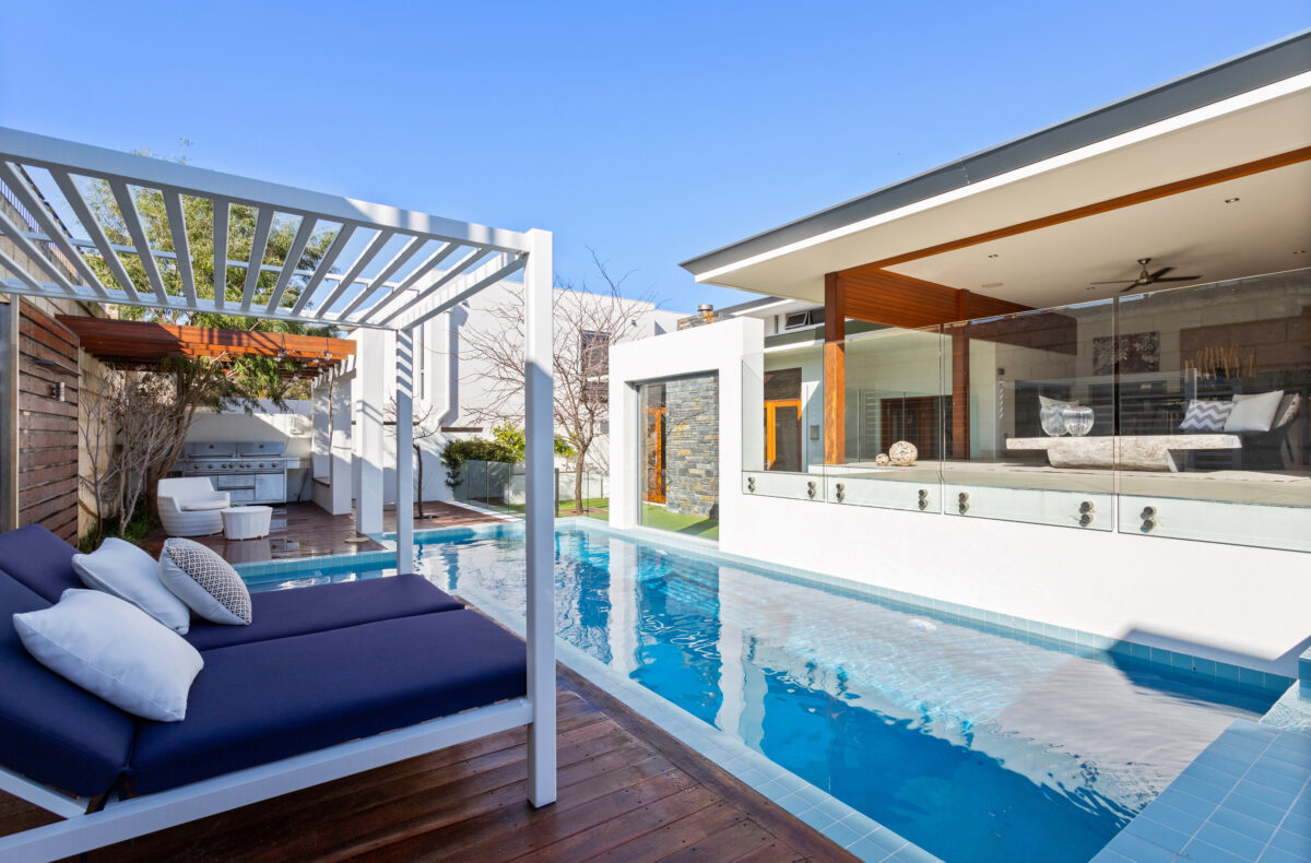 long, thin swimming pool of the display home by oswald homes