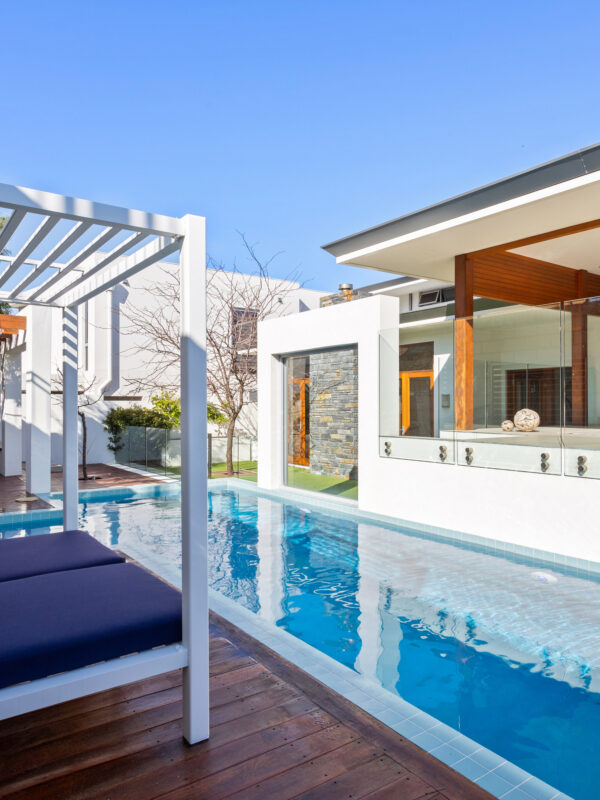 long, thin swimming pool of the display home by oswald homes