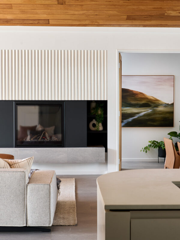 open plan Kitchen, living and dining area with statement fireplace and wooden ceiling