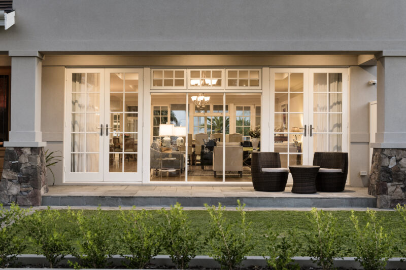 french doors leading to an alfresco area of a hamptons home