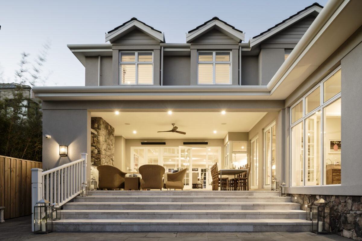 alfresco area of hamptons home in the evening