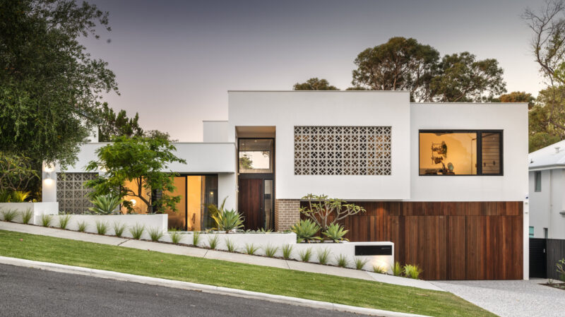 Single storey home with breeze block screening and timber entry