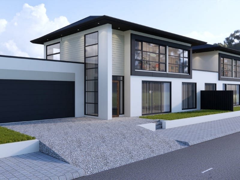 Black and white house with a black roof and black garage