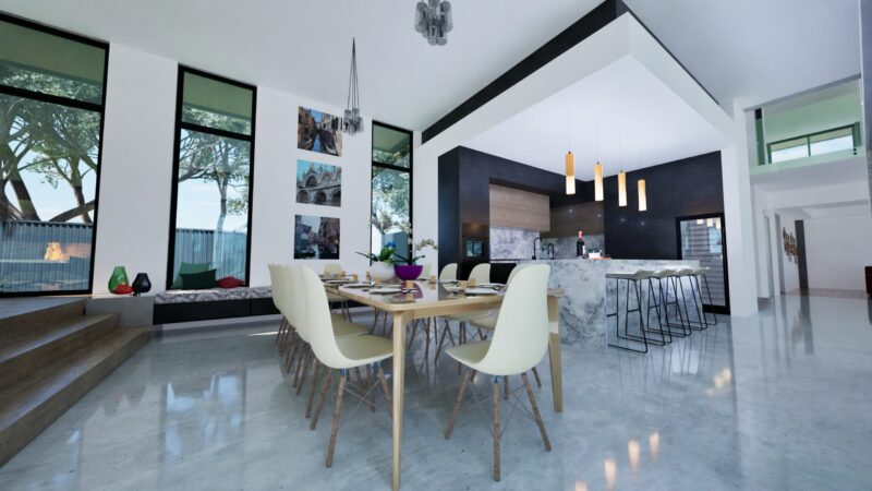 Render of a dining area with white chairs and the kitchen beyond