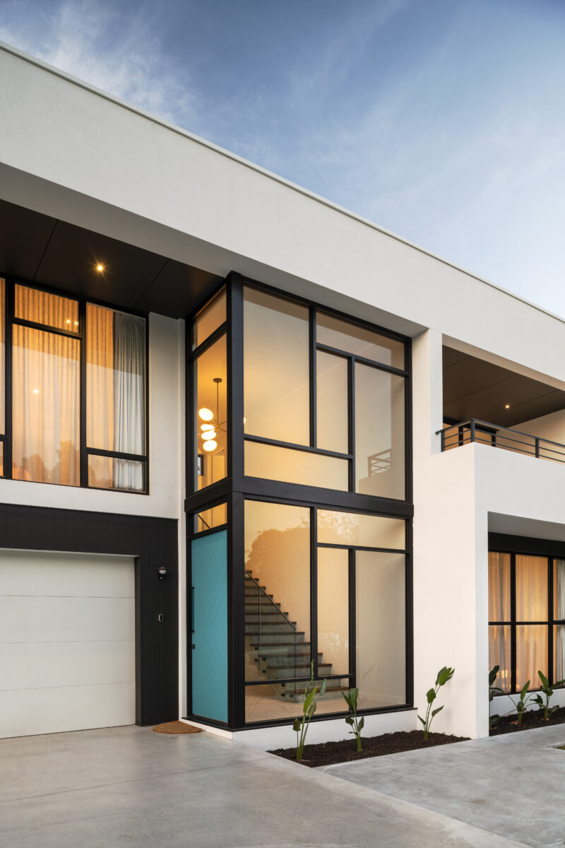 The Nelson Mid Century Modern Home by Luxury Custom Home Builders Oswald Homes featuring boutiful windows