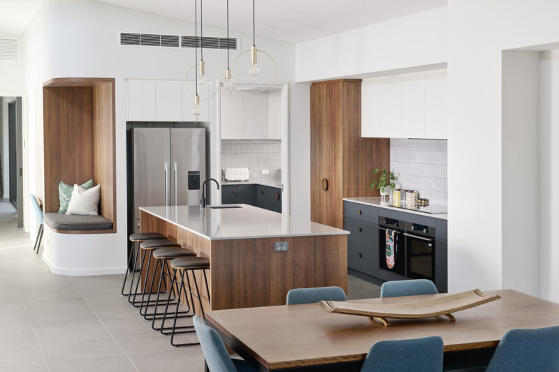 Kitchen with timber joinery, island bench and built in window seat